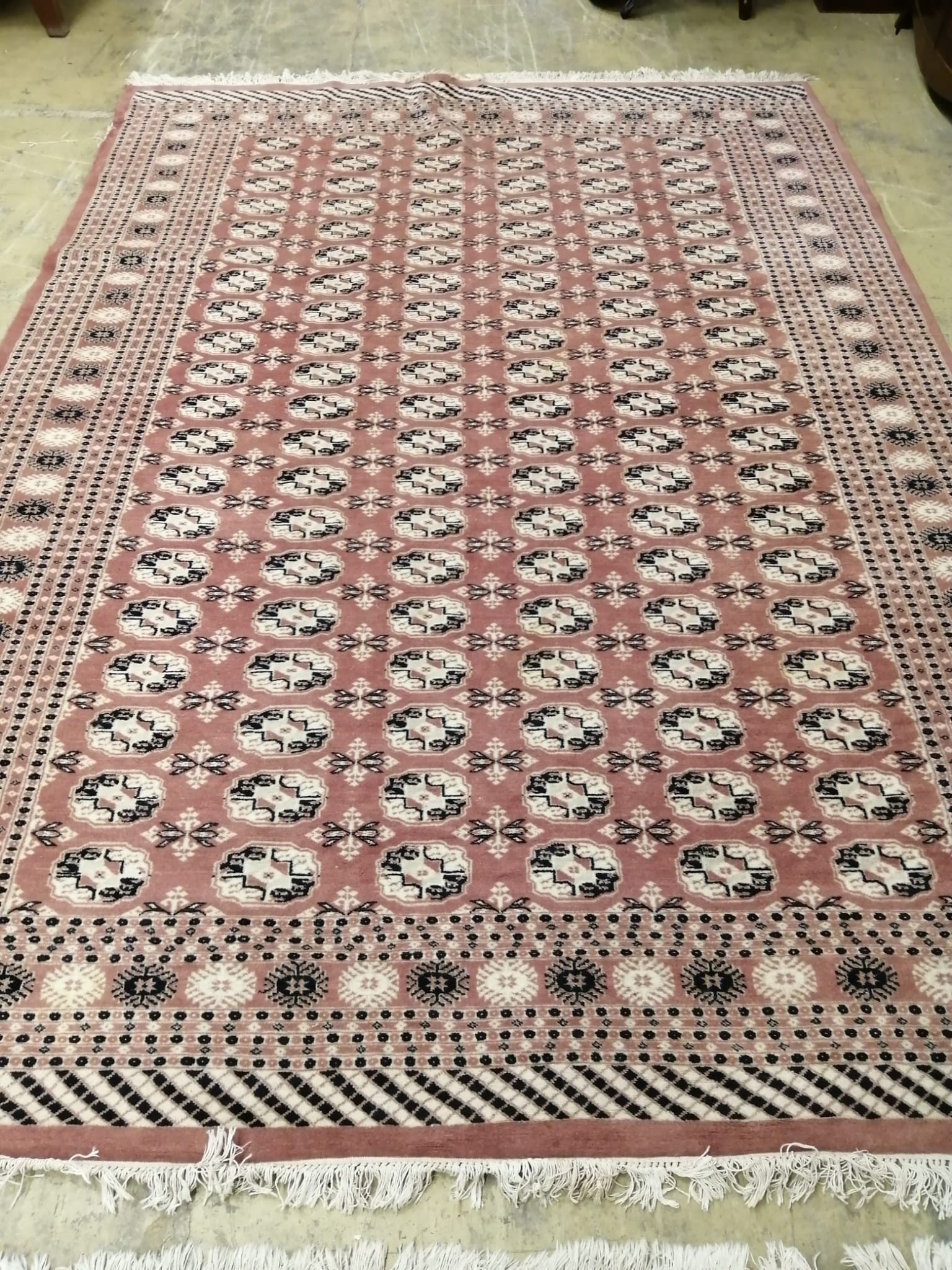 A pair of Bokhara peach ground carpets, 310 x 218cm